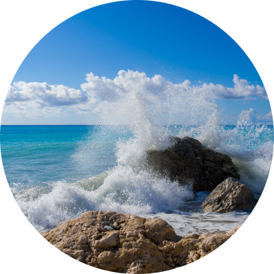 Ocean wave crashing on rocks.